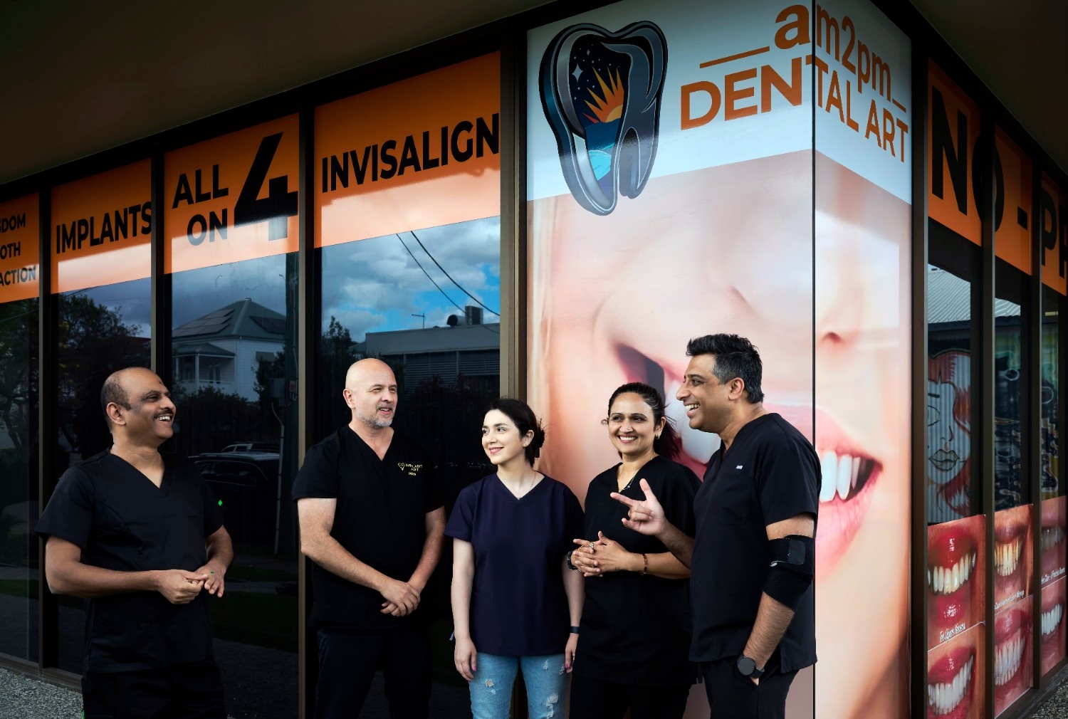 boy in blue long sleeve shirt drinking from a feeding bottle